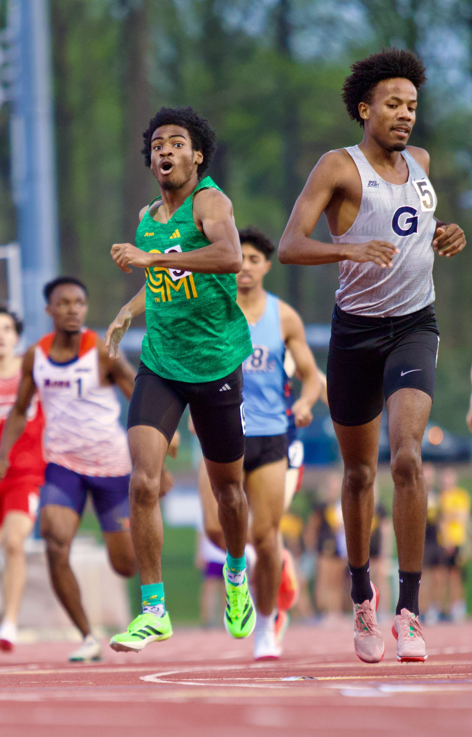 George Mason athlete shocked as he crosses the line in a lifetime best.