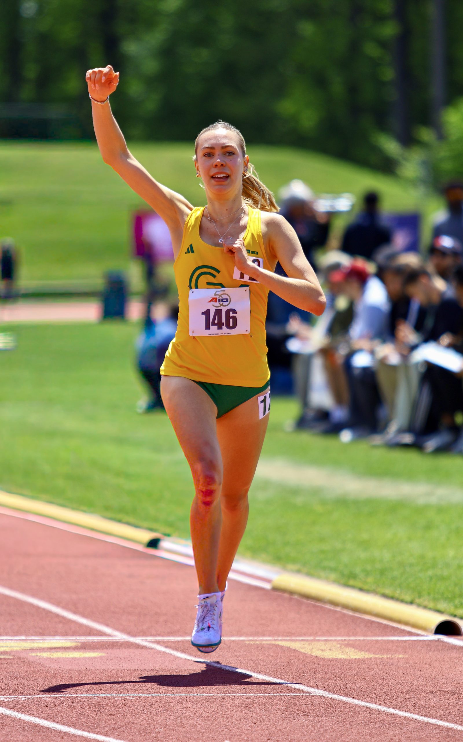 George Mason runner celebrates conference title. 