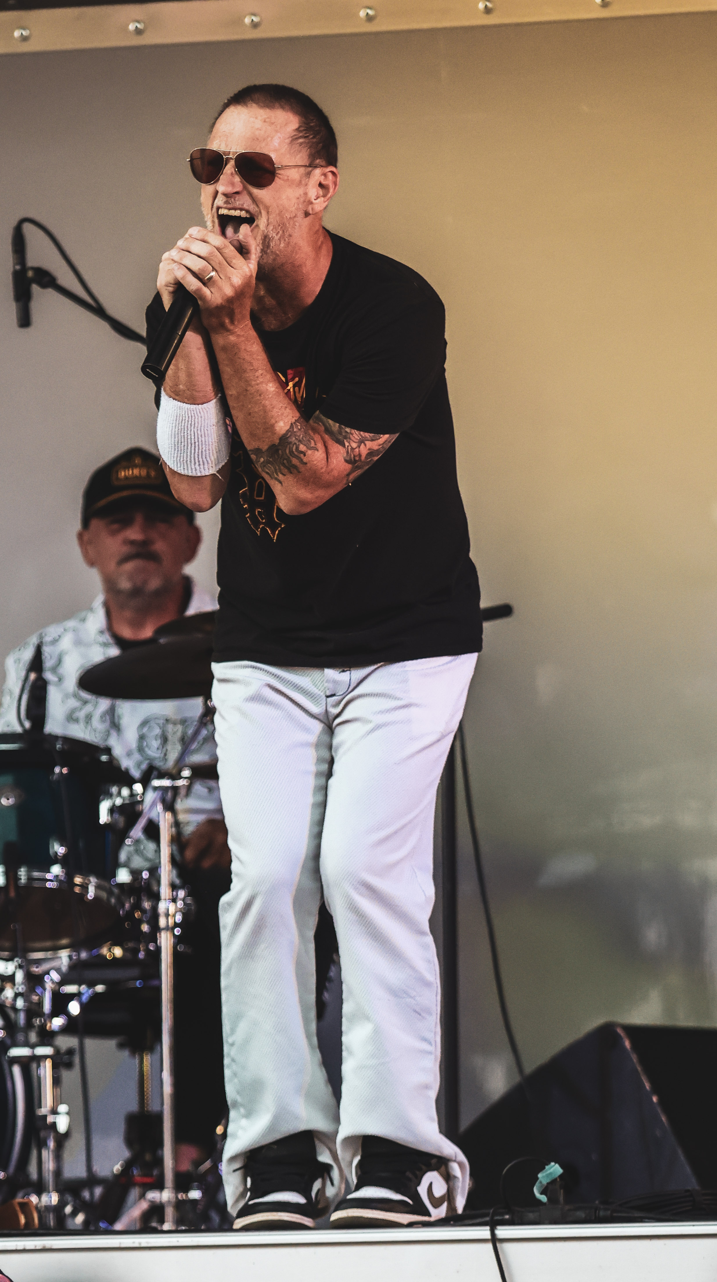 Vocalist and drummer perform mid set.