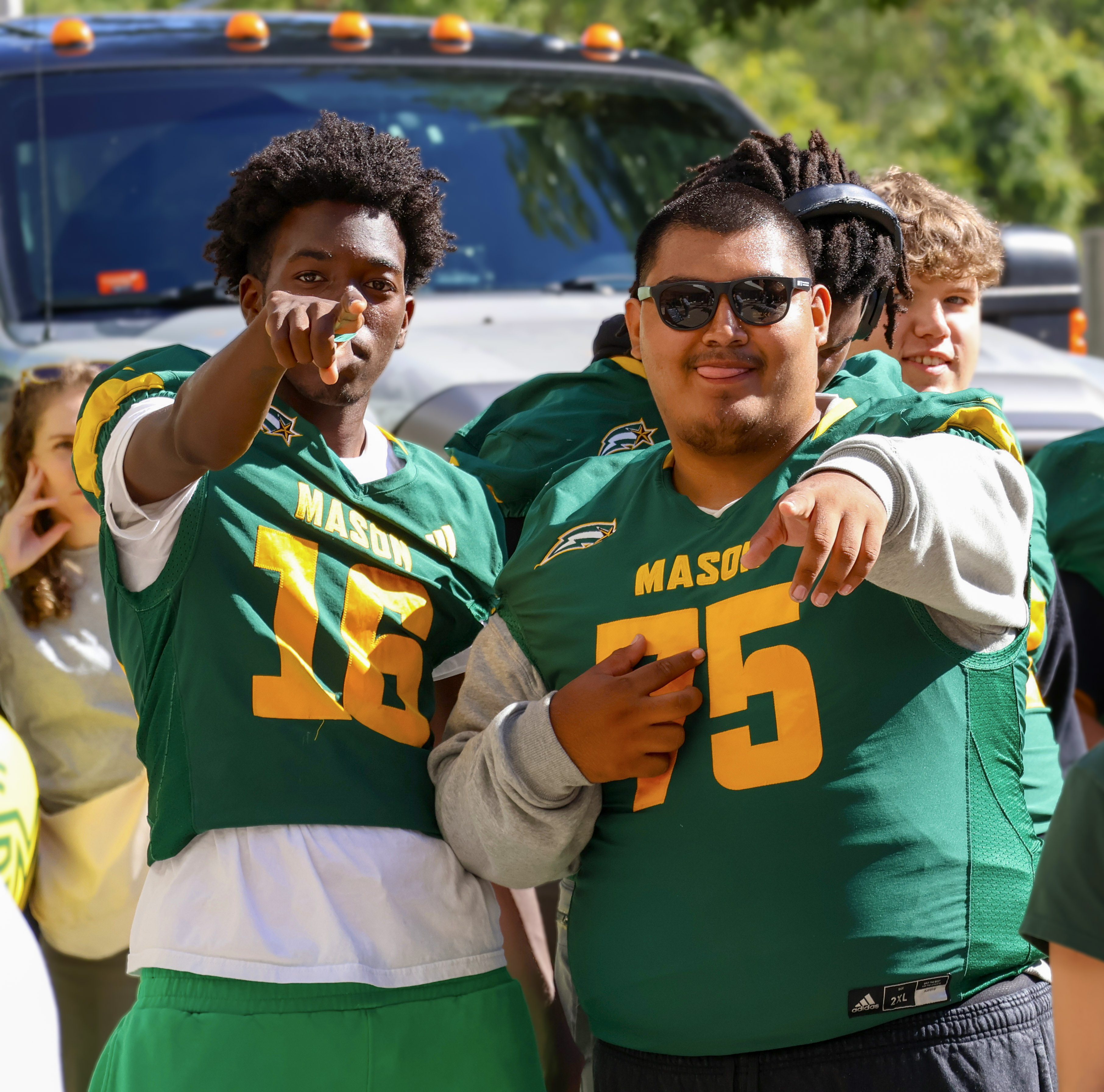 Teammates pose at a fundraiser.