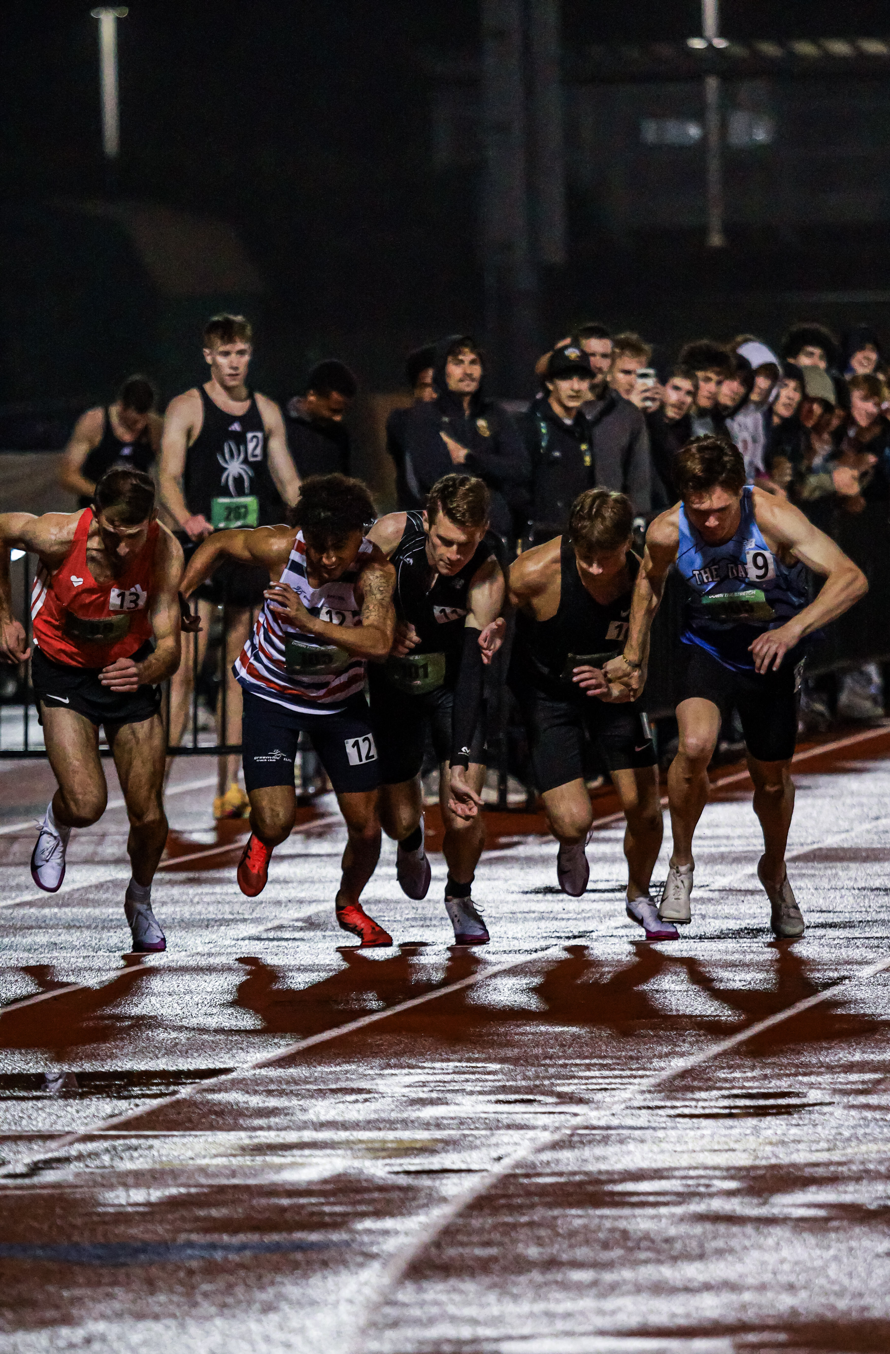 Runners battle for position at the start of the race. 